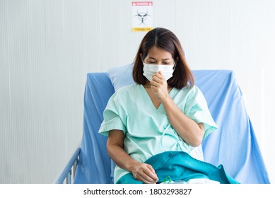 COVID-19, Corona Virus Outbreak, Quarantine And Epidemic Spread Concept. Asian Depressed CORONA Or COVID-19 Patient Infection Wear Mask And Get Blood Transfusion In Quarantine Room At The Hospital