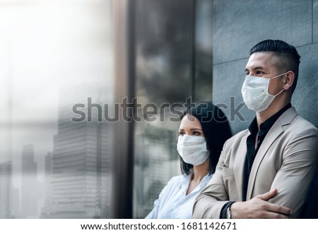 Covid-19 or Corona Virus Situation in Business Concept. Business People with Surgical Safety Mask standing at Office Urban Building. Team Employees or Owner Protected and take Care of their Health