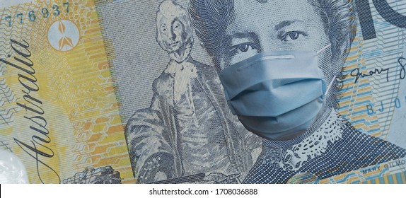 COVID-19 Coronavirus In Australia, Australian Dollar Money With Face Mask. COVID Global Stock Market Affection. World Economy Hit By Corona Virus Outbreak. Financial Crisis And Coronavirus Pandemic