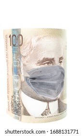 COVID-19 Coronavirus In Canada, 100 Dollar Money Bill With Face Mask. COVID Affects Global Stock Market. 