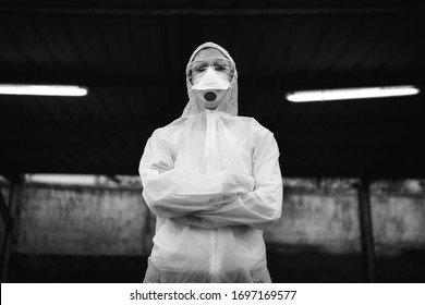 COVID-19 Coronavirus Doctor In Hazmat Suit.Infectious Disease Pandemic Medical Worker.Female Physician In Uniform On Frontline,fighting Viral Outbreak.Protective Suit With N95 Mask.