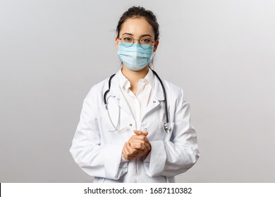 Covid19, Coronavirus, Healthcare And Doctors Concept. Portrait Of Asian Doctor In Medical Mask And White Coat, Stethoscope, Look After Patients Checking Lungs, Consulting How Prevent Caught Virus