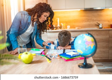 Covid-19 Coronavirus and Learning from home, Home school kid concept.Little boy study with online learning with mother help. Quarantine and Social distancing concept. Learning at home, online learning