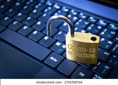 COVID-19 coronavirus lockdown restrictions ease concept illustrated by unlocked padlock on laptop. - Shutterstock ID 1741950764