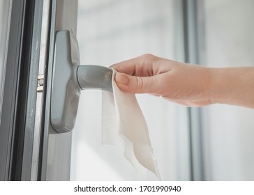 COVID-19 Coronavirus 
Prevention Cleaning Woman Wiping Doorknob With Antibacterial Disinfecting Wipe For Killing Corona Virus On Touching Surfaces Or Touching Public Bathroom Handle With Tissue.