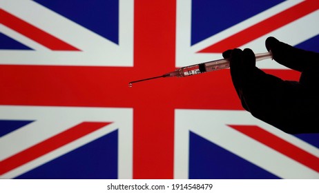 Covid-19 CORONAVIRUS VACCINE AND SYRINGE WITH FLAG BACKGROUND OF VARIOUS COUNTRIES  - Uk England 