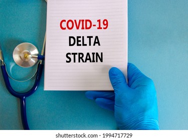 Covid-19 delta variant strain symbol. Doctor hand in blue glove with white card. Concept words 'Covid-19 delta strain'. Stethoscope. Medical and COVID-19 delta variant strain concept. Copy space.