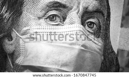 COVID-19, economy and crisis concept, US president Franklin's eyes and face mask on 100 dollar money bill. Corona virus affects global stock market. World finance hit by coronavirus pandemic fears.