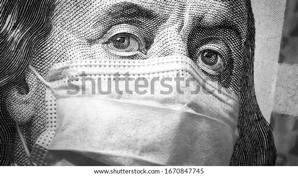 COVID-19, economy and crisis concept, US president
Franklin's eyes and face mask on 100 dollar money bill. Corona
virus affects global stock market. World finance hit by coronavirus
pandemic fears.