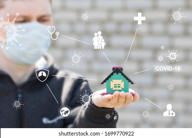 COVID-19 Family House Readiness Concept. Stay At Home, Stay Safe. Save Lives From Coronavirus. Man Showing The Home I Stay At Home.