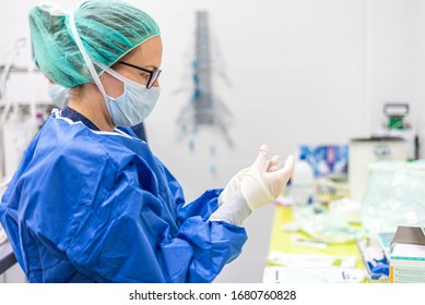 Covid-19. Female nurse puts on protective gloves. Personal protective equipment in the fight against Coronavirus disease . - Shutterstock ID 1680760828
