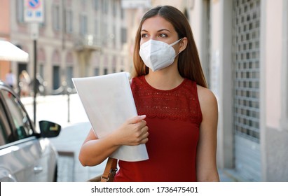 COVID-19 Global Economic Crisis Unemployed Worried Girl with KN95 FFP2 Mask Looking for a Job Walking in City Street Delivering Curriculum Vitae