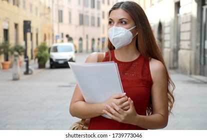 COVID-19 Global Economic Crisis Unemployed Worried Girl With KN95 FFP2 Mask  Looking For Job Walking In City Street Delivering Curriculum Vitae