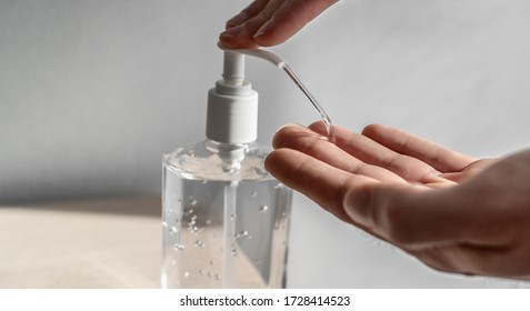 COVID-19 Hand Sanitizer Cleaning Hands With Alcohol Disinfecting Gel Bottle Man Using Dispenser For Coronavirus Prevention. Wash Your Hands.