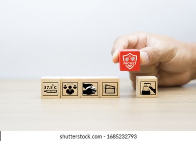 Covid-19 icon on wooden toy block. Concepts for health care and prevention of coronavirus infection, Social Distancing and stay home or work from home. - Shutterstock ID 1685232793