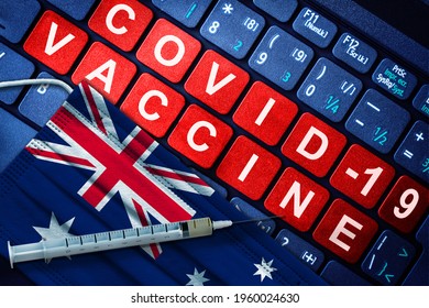 COVID-19 Immunization In Australia Showing Syringe And Face Mask With Australian Flag And Vaccine Message On Computer Keyboard. Concept Of Covid Vaccination In Australia