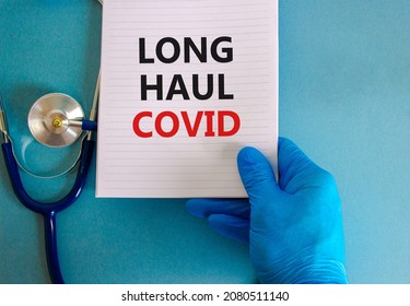 COVID-19 long-haul covid symptoms symbol. White card with words Long haul covid. Doctor hand, stethoscope, beautiful blue background, copy space. Medical, COVID-19 long-haul covid symptoms concept. - Shutterstock ID 2080511140