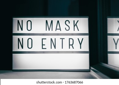 Covid-19 Mask Obligatory To Enter Stores . SIGN NO MASK NO ENTRY At Storefront Window. Face Covering Wearing Mandatory When Shopping Outside Of Home. Coronavirus Prevention Measure.