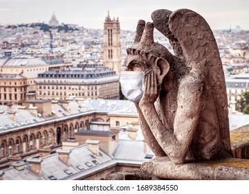 COVID-19 And Monkeypox In France, Funny Gargoyle Of Notre Dame De Paris With Medical Mask. Tourist Landmarks Closed Due To Corona Virus. Concept Of Travel In Europe, Tourism, Lockdown And Coronavirus