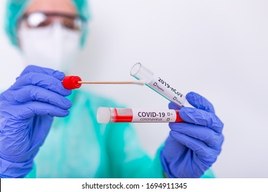 COVID-19 Nasal swab laboratory test in hospital lab, Nurse holding test tube with blood for 2019-nCoV analyzing. Novel Coronavirus blood test Concept.