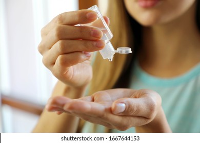COVID-19 Pandemic Coronavirus Close up woman hands using wash hand sanitizer gel dispenser, against 2019-nCoV at home. Home isolation, Auto Quarantine, Antiseptic, Hygiene and Healthcare concept. - Shutterstock ID 1667644153