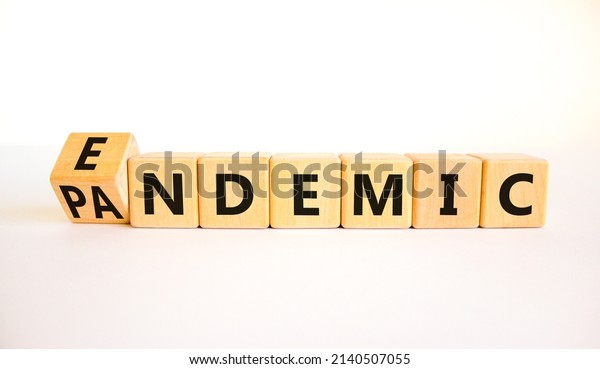 Covid-19 pandemic or endemic symbol. Turned\
wooden cubes and changed the concept word Pandemic to Endemic.\
Beautiful white background copy space. Medical Covid-19 pandemic or\
endemic concept.