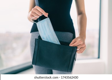 COVID-19 Prevention Woman Bringing Medical Mask In Her Purse For Walking Outside Doing Errands In Public Spaces And Store. Coronavirus Face Masks Protection Obligatory Wear To Work.