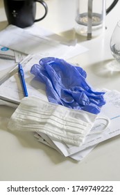 Covid19 Protective Gear On A Kitchen Counter , Including Gloves And Mask Sit On Mail