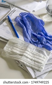 Covid19 Protective Gear On A Kitchen Counter , Including Gloves And Mask Sit On Mail