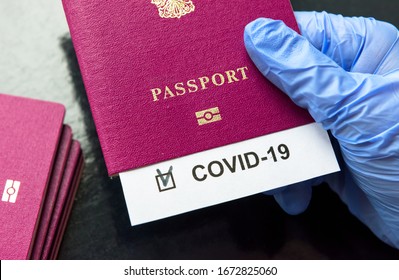 COVID-19, Travel Concept, COVID Mark In Tourist Passport. Medical Test In Airport Due To Corona Virus Restrictions. Concept Of Business, World Lockdown, Tourism In Europe, Pandemic And Positive Result