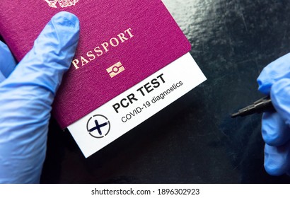 COVID-19 And Travel Concept, Mark Of Positive Coronavirus PCR Testing In Tourist Passport. PCR Test In Airport Due To Border Restrictions During Pandemic. Tourism And Business Hit By Corona Virus.