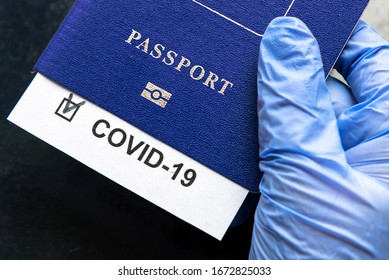 COVID-19, travel, health and lockdown concept, COVID mark in tourist passport. Medical test in airport due to tourism restrictions. Document, passport, corona virus, pass, EU and pandemic theme.