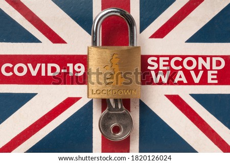 Covid-19 UK lockdown concept: a lock over a union jack flag with the message 