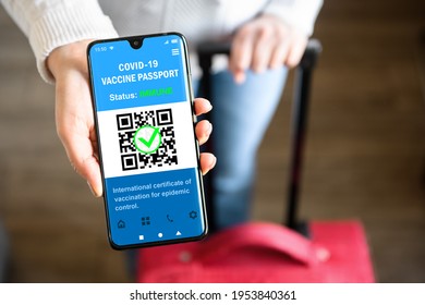 COVID-19 vaccination pass with green sign in mobile phone for travel, tourist shows health certificate app, digital pass in smartphone at airport. Concept of corona, immunity passport, test, tourism. - Shutterstock ID 1953840361