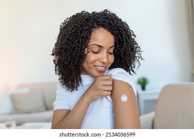 Covid-19 Vaccination. Portrait Of Happy Vaccinated African woman Showing Her Arm After Coronavirus Antiviral Vaccine Shot . Covid Immunization Campaign Concept. - Powered by Shutterstock