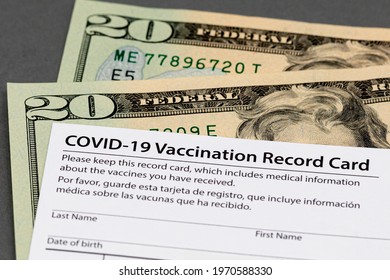 Covid-19 Vaccination Record Card And Cash Money. Fake, Vaccine Card Fraud And Forgery Concept