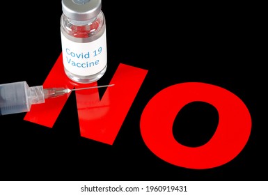 Covid-19 Vaccine Bottle With Hypodermic Needle On A NO Sign To Indicate Anti-vaccine