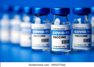 Covid-19 Vaccine - Coronavirus Vaccination Bottles. Injection Vials In A Row