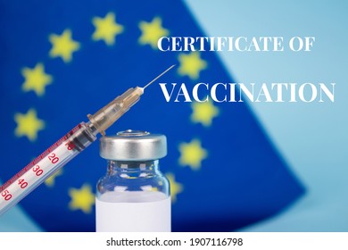 COVID-19 Vaccine Vial Against EU Flag On Blue Background - Digital Certificate Of Vaccination Concept, EU Vaccine Passport. Selective Focus