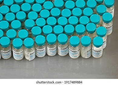 Covid-19 Vaccine Vials Production Manufacturing In Pharma Industry On Laboratory Shelf