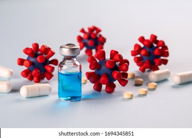 COVID-19,Coronavirus concept. Medication for treatment and prevention of new corona virus infection,  and models of covid-19 virus on blue background. - Shutterstock ID 1694345851