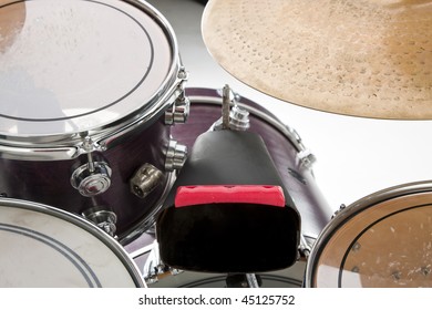 A Cow Bell And Drum Set Isolated On White