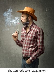 Cow Boy Blowing On Smoke Gun