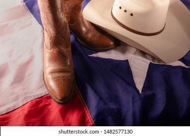 Cowboy Boots And Hat On Texas Flag