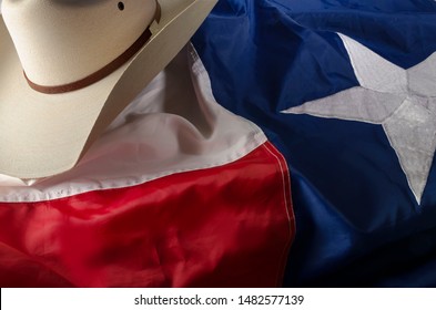 Cowboy Boots And Hat On Texas Flag