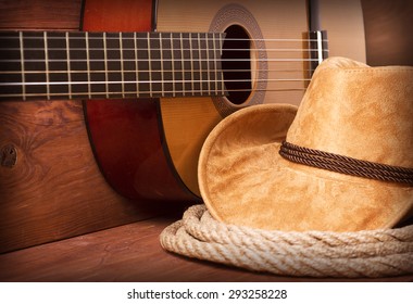Cowboy country music image with guitar and american hat