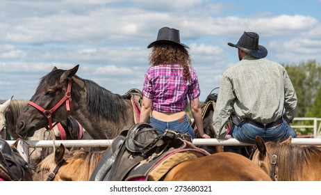 Cowboy Couple Sit Back  And Behold Horses