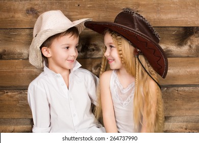 Cowboy And Cowgirl Kid Looking At Each Other