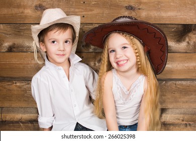 Cowboy And Cowgirl Kid Smiling Portrait