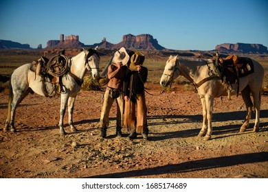 Cowboy  Family With Horse At Monument Valley